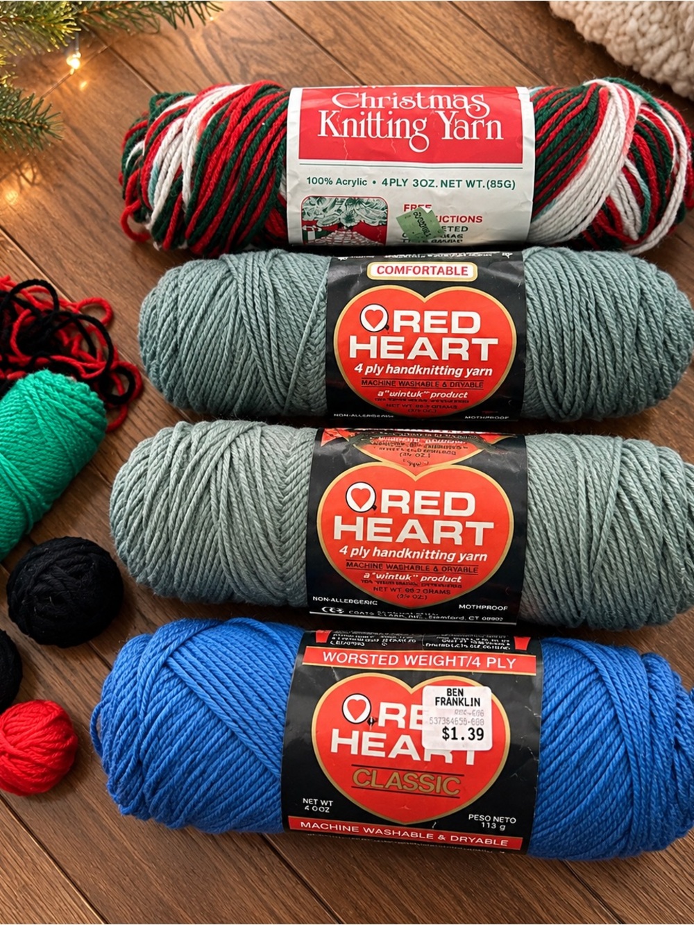 Vintage yarn bundle with Christmas knitting yarn, blue, green, and red skeins